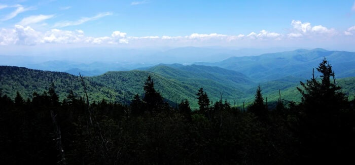 A view of the mountains from a mountain top.